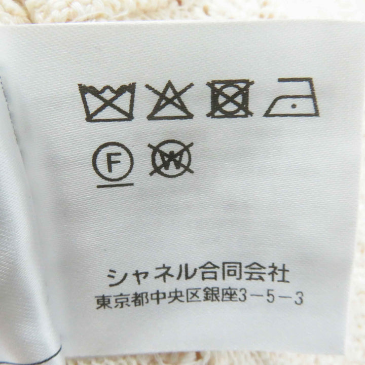 極美品◎CHANEL シャネル 23S P75071 ラインストーンココマークボタン付き クロップド丈 カーディガン ライトオレンジ 36 保存袋付き