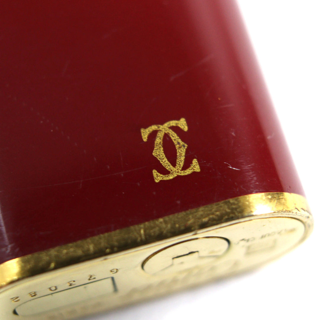 良品○Cartier カルティエ トリニティ ラッカー オーバルフォルム ローラー式 喫煙グッズ ガスライター ボルドー ゴールド 着火確認済