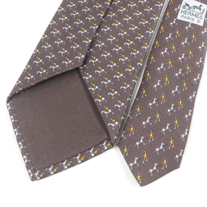 極美品□HERMES エルメス 625657 シルク100％ Jockey&amp;Toy Horse 総柄 レギュラータイ ネクタイ ブラウン 箱付き フランス製 メンズ