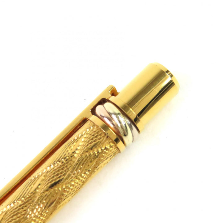 美品△Cartier カルティエ マスト ドゥ カルティエ トリニティ ウェーブ柄 ツイスト式 ボールペン 希少 ゴールド メンズ 筆記確認済み