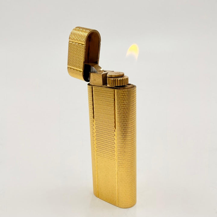 美品◇Cartier カルティエ オーバル型 総柄 ローラー式 ガスライター 喫煙具 ゴールド スイス製 メンズ 着火確認済み