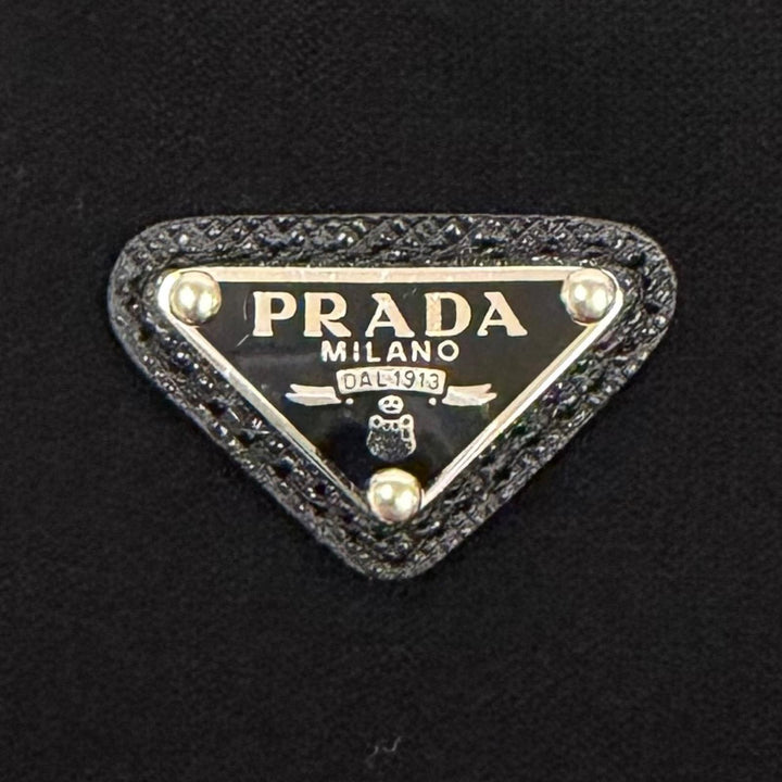 未使用品★PRADA プラダ 22225 ウール混 トライアングルロゴプレート ニットパンツ ボトムス ブラック 38 イタリア製 正規品 レディース