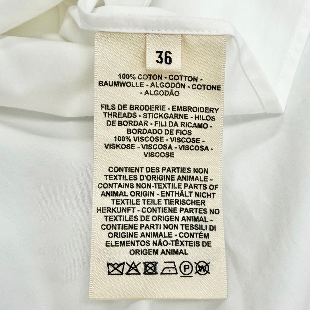極美品△HERMES エルメス 23SS 3E0638DT カレーシュ コットン100％ ロゴボタン 長袖シャツ ホワイト 36 フランス製 レディース
