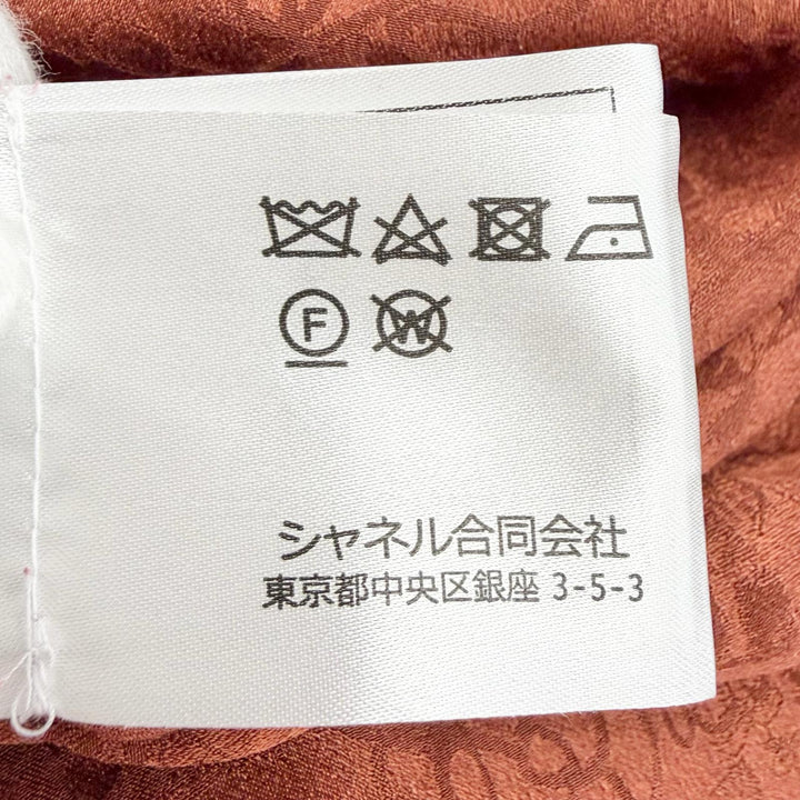 極美品△CHANEL シャネル P77750V69506 シルク100％ ココマーク 総柄 ライオンボタン ボータイ付き ブラウス ブラウン FR 36 仏製 正規品