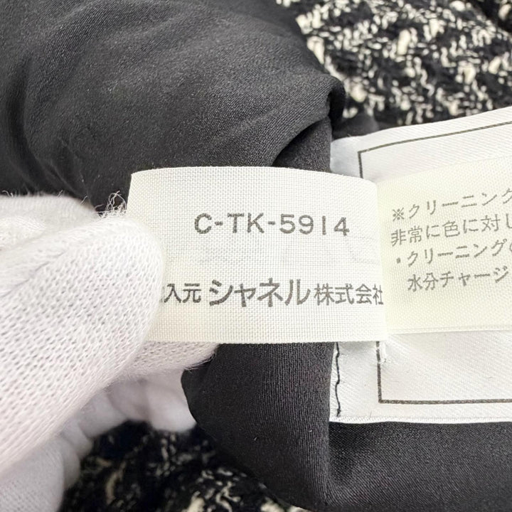 美品△CHANEL シャネル ヴィンテージ 97A P09701 ウール ココボタン ミックスツイード スカートスーツ セットアップ 黒計 FR 38 正規品